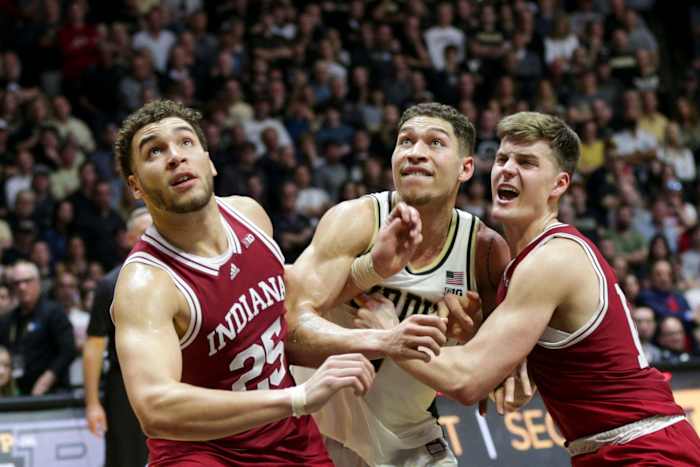 Indiana forwards Race Thompson and Miller Kopp box out Purdue forward Mason Gillis